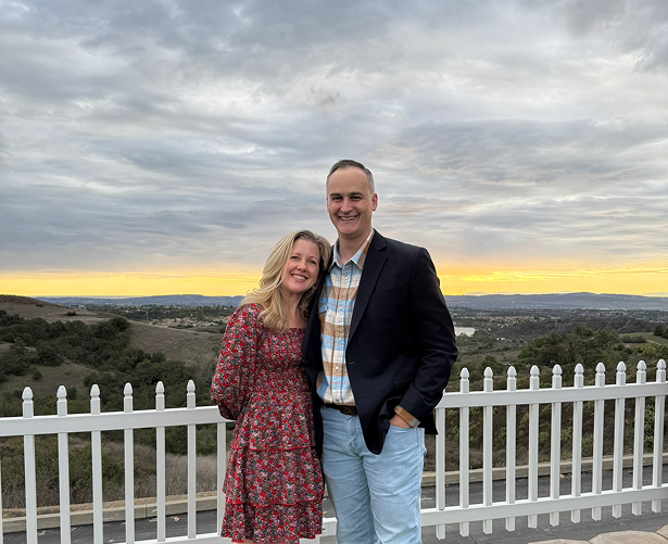 Couple posing at sunset view.