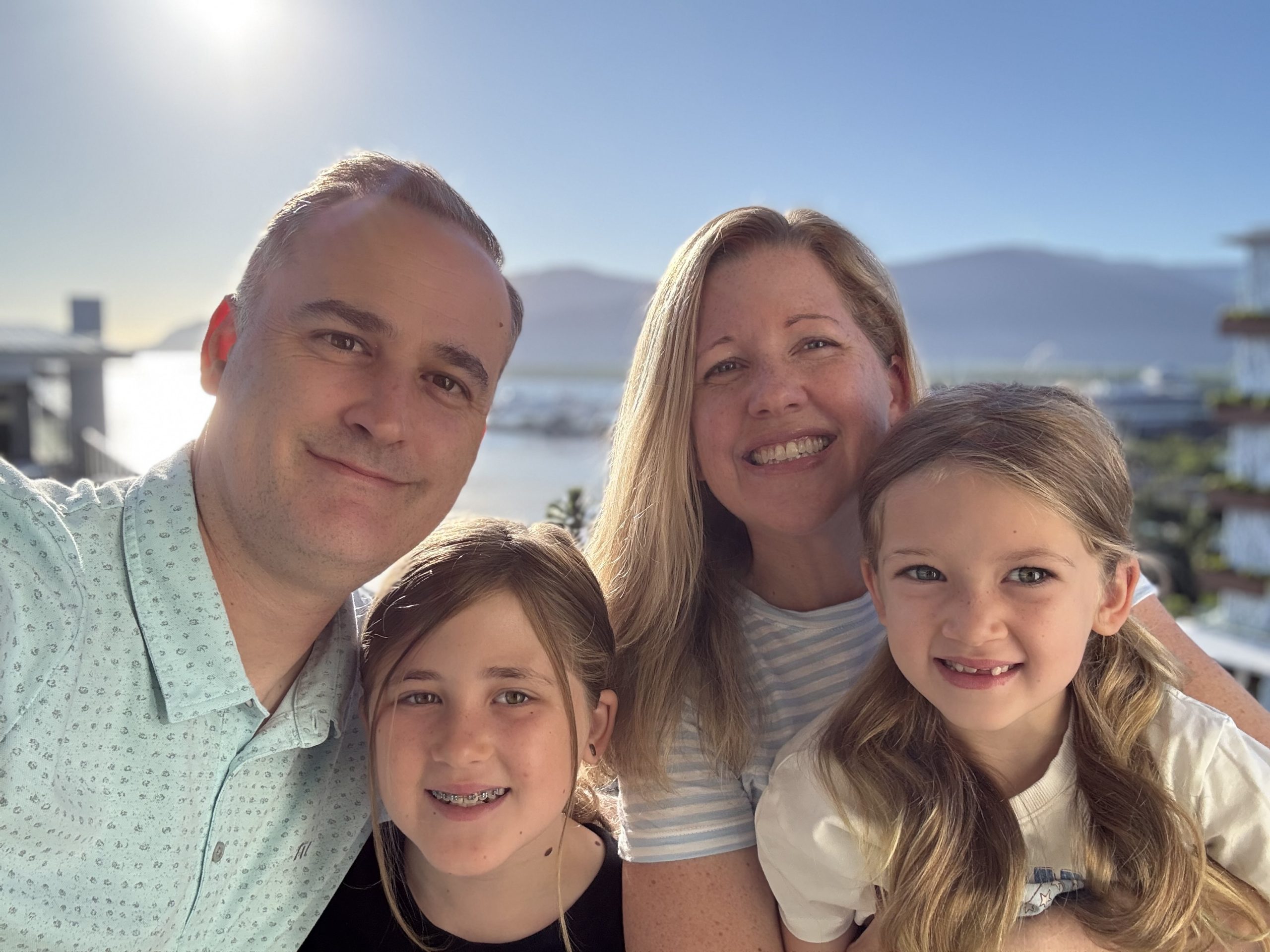 Family portrait with scenic background.