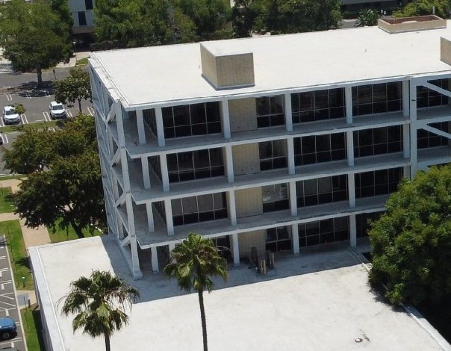 Modern building surrounded by greenery.