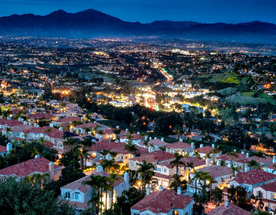Night view of illuminated hillside homes